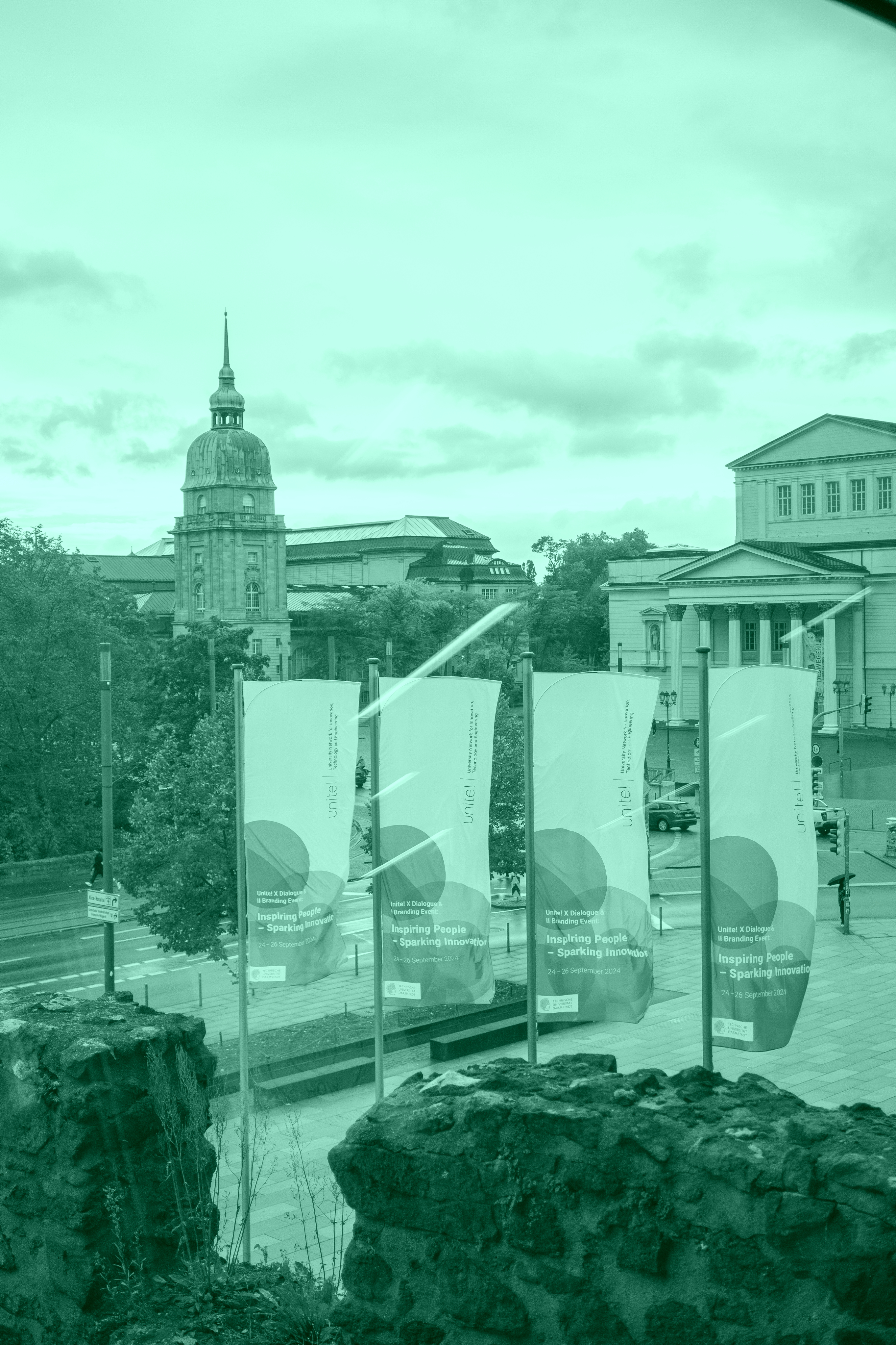 Exterior view of TU Darmstadt with Unite! flags displayed