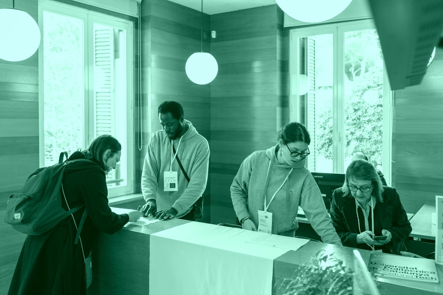 University staff welcoming and providing information to visitors