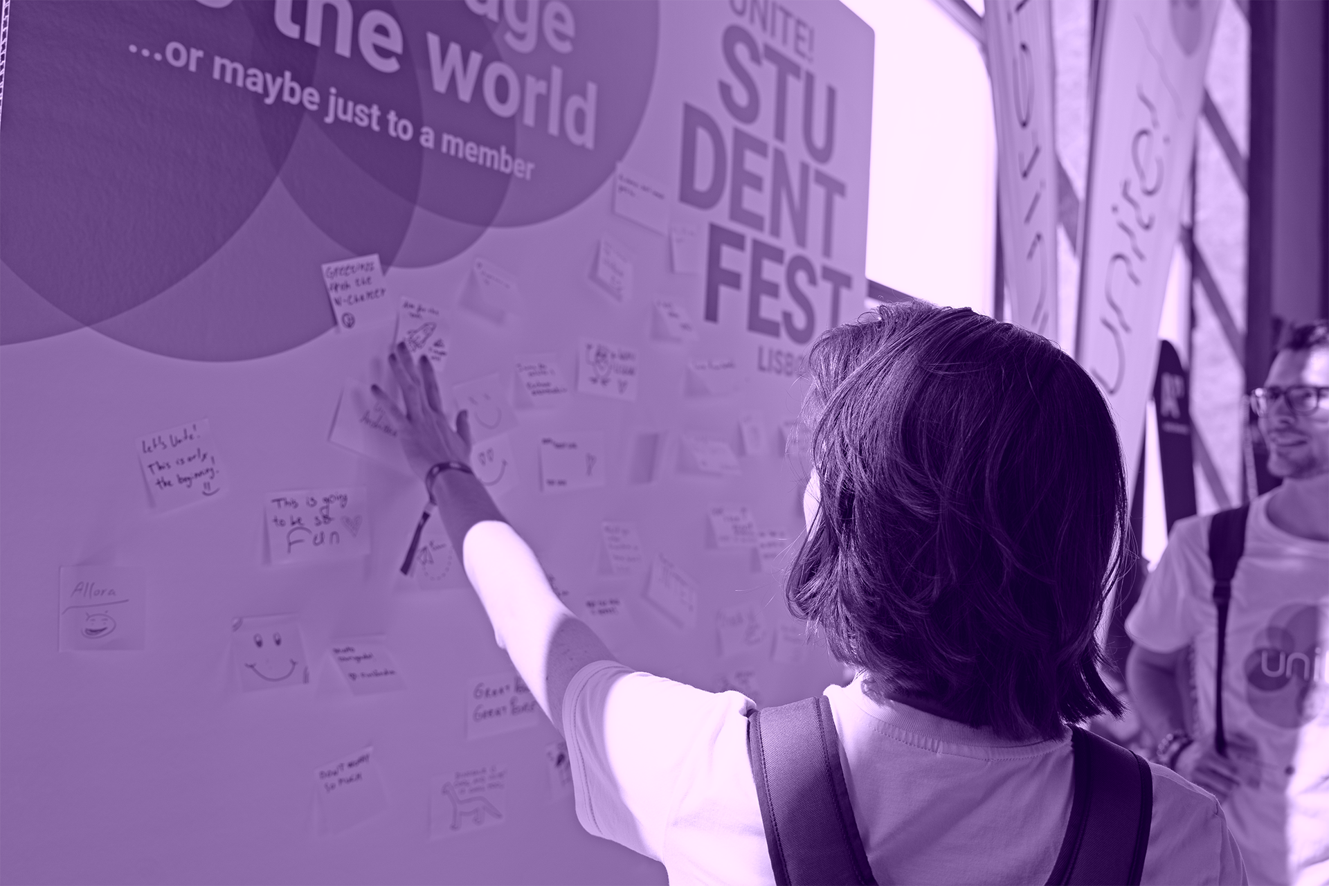 Student looking at a Unite! idea board