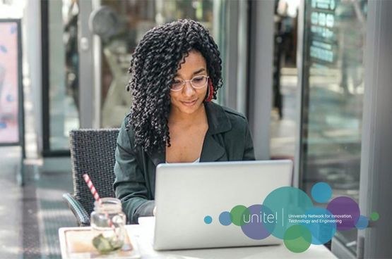 Woman working on a laptop.