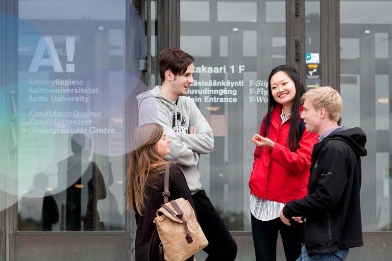 Students in front of an Aalto university building.