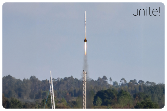 Rocket taking off in a field