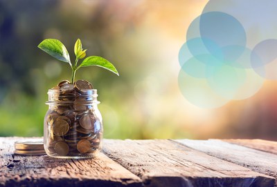 Image of a jar of money with a plant coming out of it representing "seed funding"